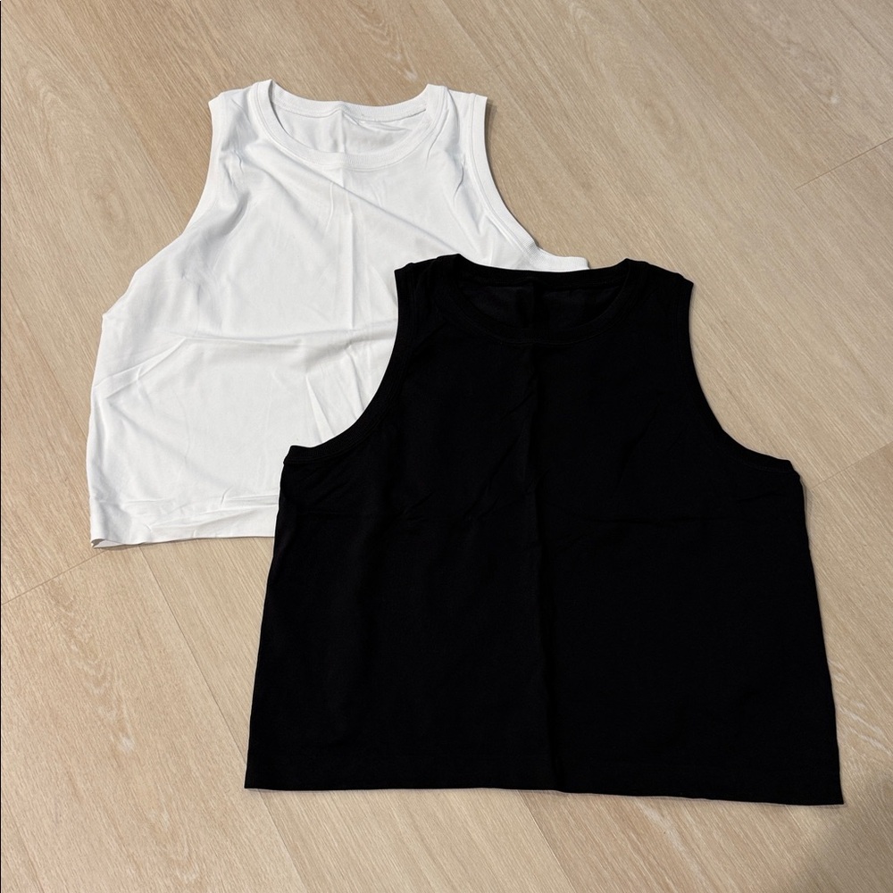 Two Athleta sleeveless seamless tops. Never worn